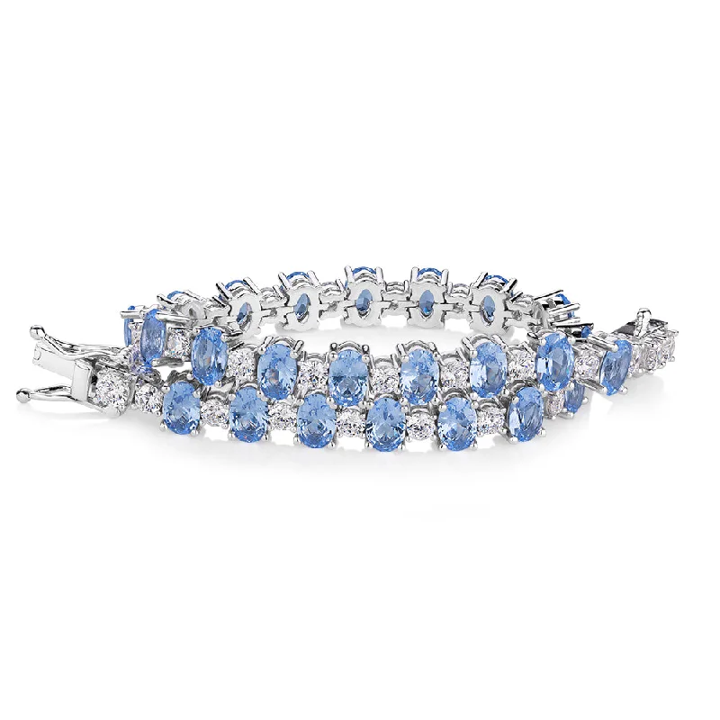 Stunning Gemstone Bracelet-Oval and Round Brilliant tennis bracelet with blue topaz simulants and 3.26 carats* of diamond simulants in sterling silver