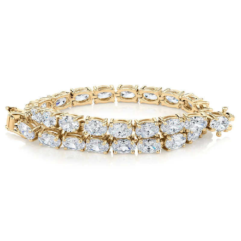 Trendy Friendship Bracelet-Oval tennis bracelet with 12.04 carats* of diamond simulants in 10 carat yellow gold